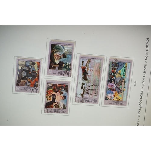 376 - A collection of British, Commonwealth and world stamps contained within seven albums together with a... 