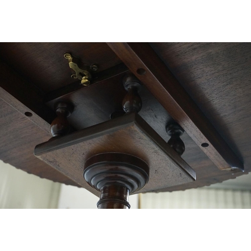 477 - Mahogany Circular Tilt Top Table in the George III style with birdcage mechanism raised on a turned ... 