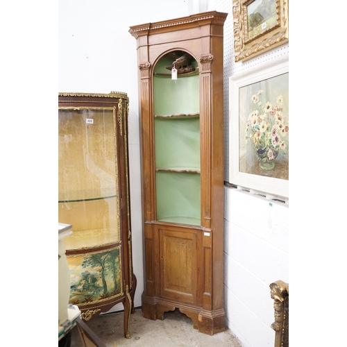 479 - Stained Pine Corner Cabinet, the green painted barrel back fixed with a carved eagle and three shelv... 