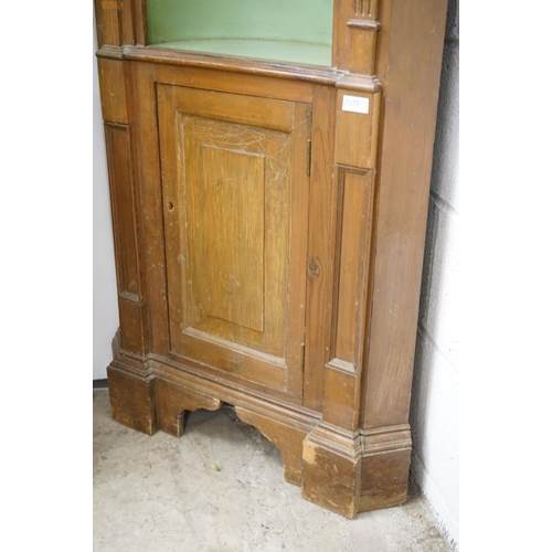 479 - Stained Pine Corner Cabinet, the green painted barrel back fixed with a carved eagle and three shelv... 