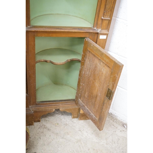 479 - Stained Pine Corner Cabinet, the green painted barrel back fixed with a carved eagle and three shelv... 