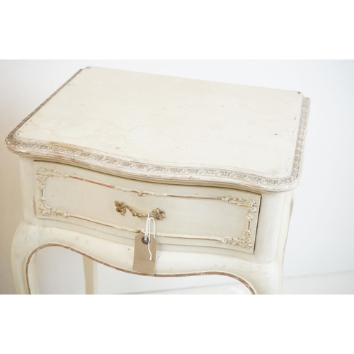 486 - Pair of French style Cream Painted Bedside Cabinets with moulded floral detail, each with a single d... 