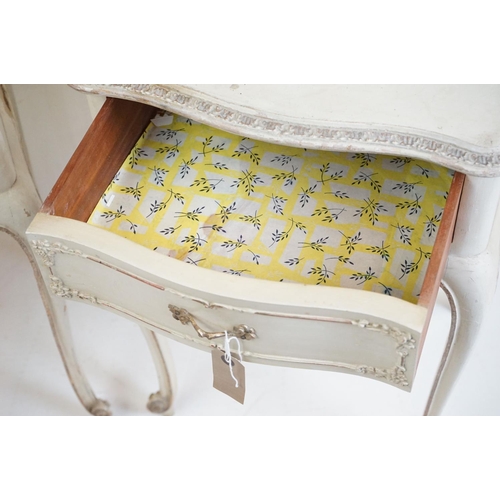 486 - Pair of French style Cream Painted Bedside Cabinets with moulded floral detail, each with a single d... 