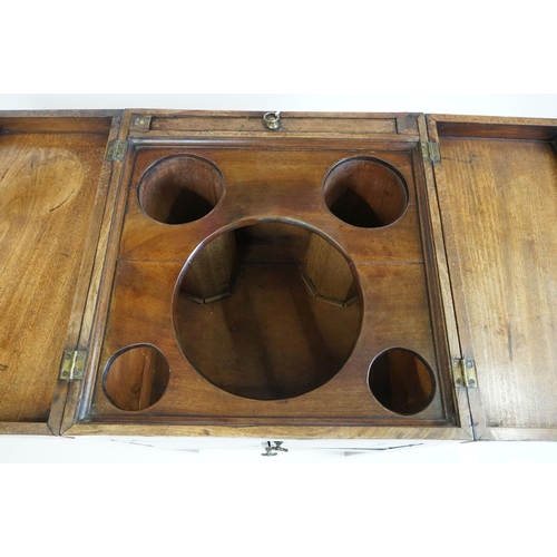 491 - George III Mahogany Washstand, the square top opening to a lift-up mirror and recesses for a wash se... 