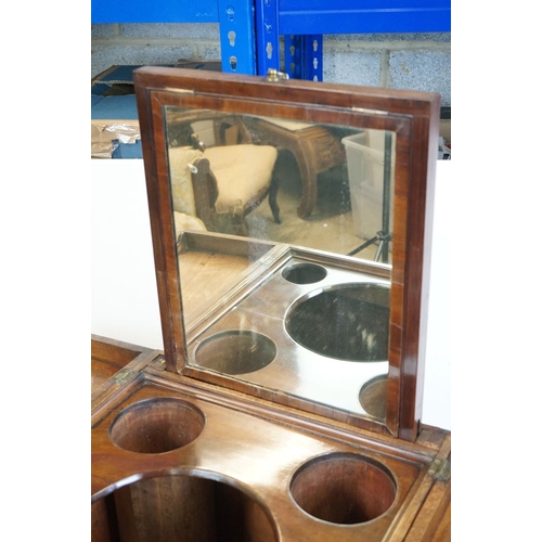 491 - George III Mahogany Washstand, the square top opening to a lift-up mirror and recesses for a wash se... 