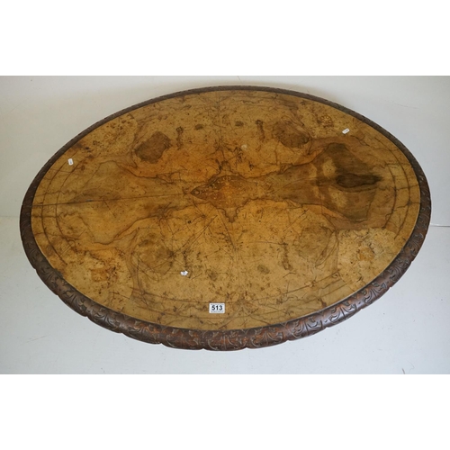 513 - Victorian Burr Walnut Oval Tilt Top Loo Table raised on four turned supports and four carved legs wi... 