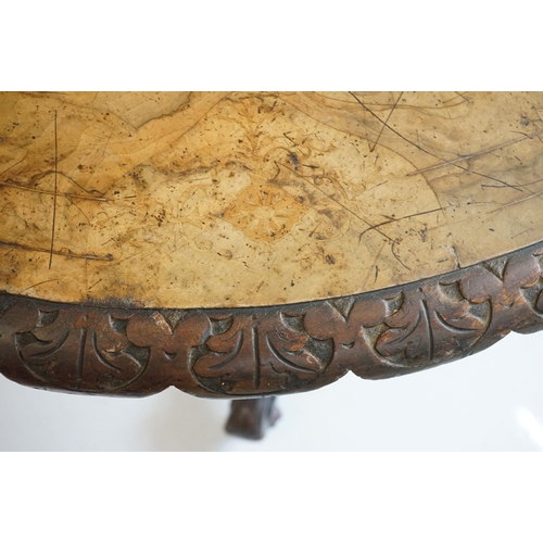 513 - Victorian Burr Walnut Oval Tilt Top Loo Table raised on four turned supports and four carved legs wi... 