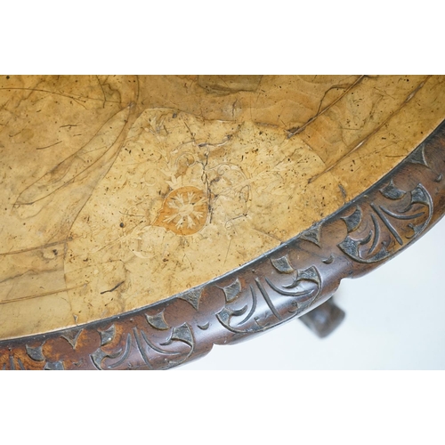 513 - Victorian Burr Walnut Oval Tilt Top Loo Table raised on four turned supports and four carved legs wi... 