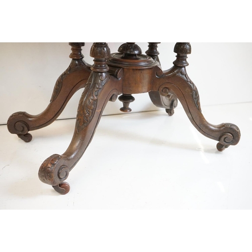 513 - Victorian Burr Walnut Oval Tilt Top Loo Table raised on four turned supports and four carved legs wi... 