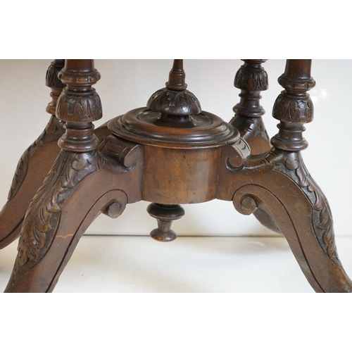 513 - Victorian Burr Walnut Oval Tilt Top Loo Table raised on four turned supports and four carved legs wi... 