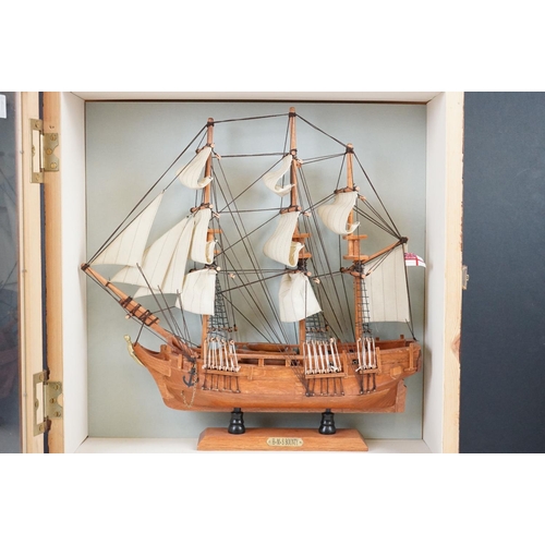 159 - HMS Bounty wooden model, with White Ensign flag, sails and rigging, housed within a wooden case. Cas... 