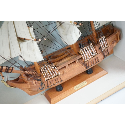 159 - HMS Bounty wooden model, with White Ensign flag, sails and rigging, housed within a wooden case. Cas... 