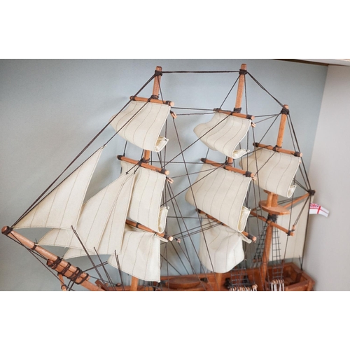 159 - HMS Bounty wooden model, with White Ensign flag, sails and rigging, housed within a wooden case. Cas... 