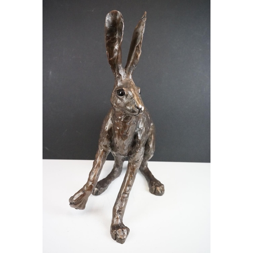 194A - A large sculpted composite Hare, signed PJ to back leg, stands approx 50cm in height (ear a/f)