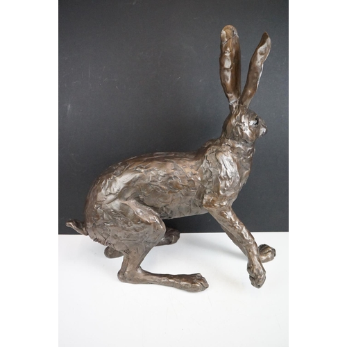 194A - A large sculpted composite Hare, signed PJ to back leg, stands approx 50cm in height (ear a/f)