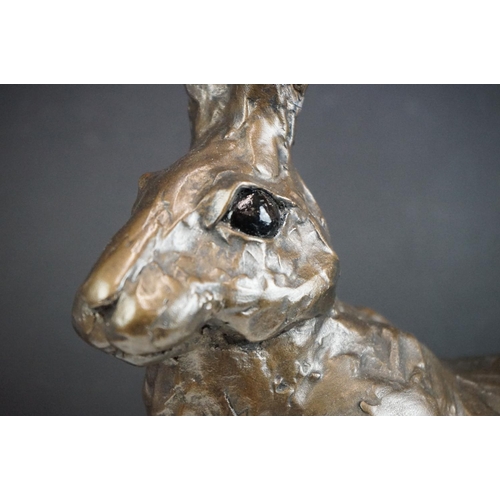 194A - A large sculpted composite Hare, signed PJ to back leg, stands approx 50cm in height (ear a/f)