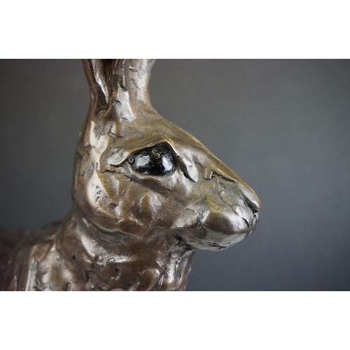 194A - A large sculpted composite Hare, signed PJ to back leg, stands approx 50cm in height (ear a/f)