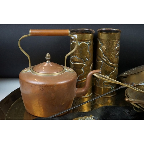 315 - A collection of mixed brass and copperware to include horse brasses, trench art vases, kettle, large... 