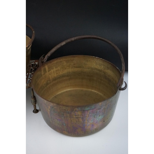 318 - A collection of mixed brass and copper ware to include two brass preserve pans, two copper jugs and ... 