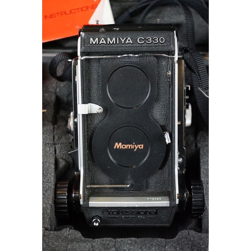 320 - A Mamiya C330 F professional medium format camera together with viewfinder, four lenses and light me... 