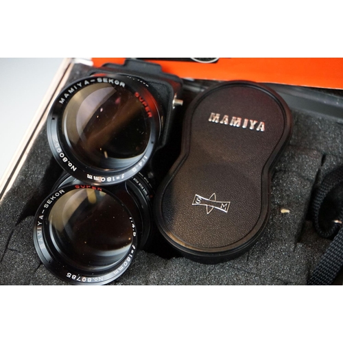 320 - A Mamiya C330 F professional medium format camera together with viewfinder, four lenses and light me... 