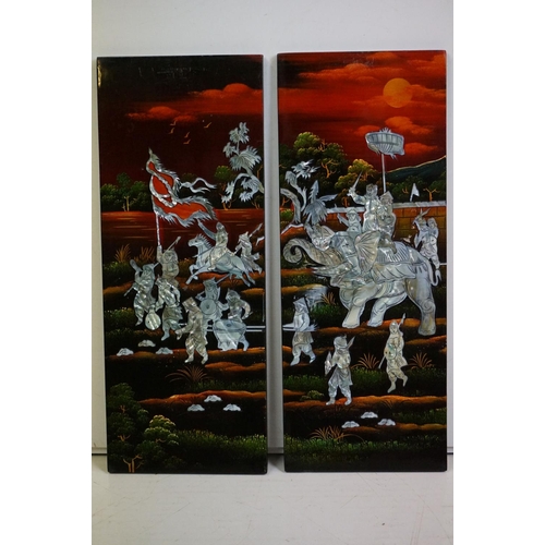 323 - A Japanese lacquerware four piece hanging wall plaque set with mother of pearl figures and animals.