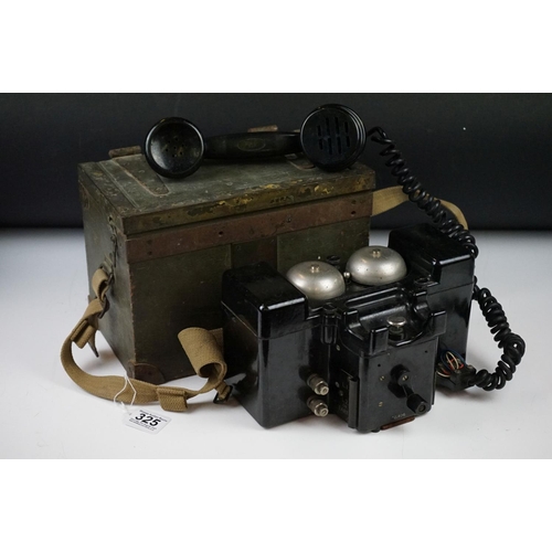 325 - A British military field telephone in original battlefield green storage case.