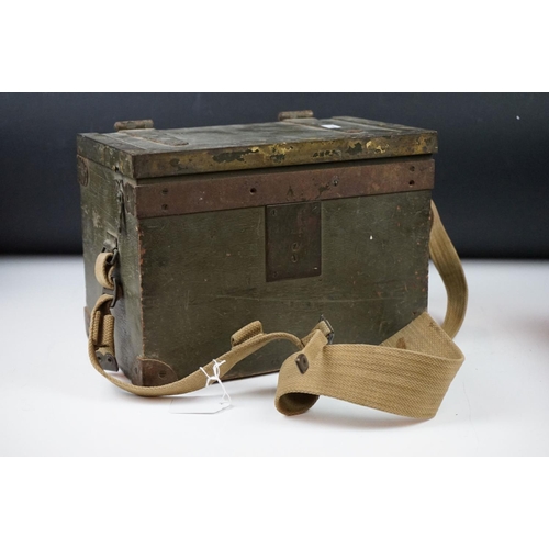 325 - A British military field telephone in original battlefield green storage case.