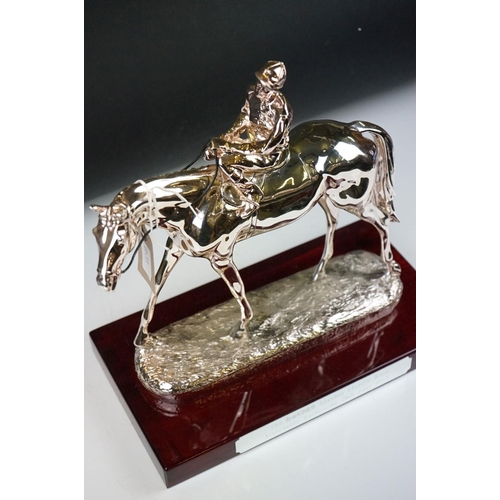 326 - Two horse racing trophies together with a brass door stop in the form of a horse and a pair of horse... 