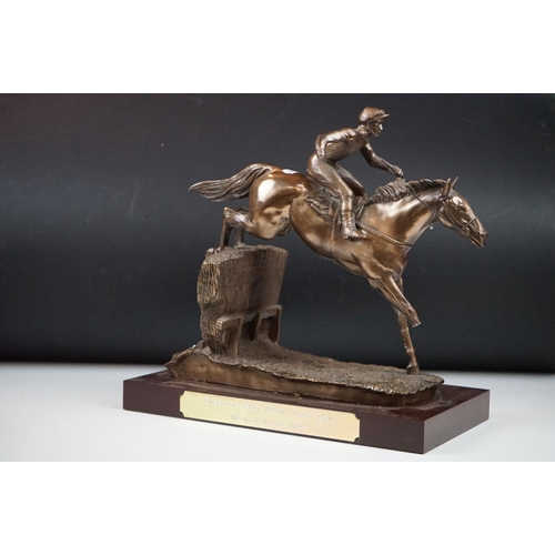 326 - Two horse racing trophies together with a brass door stop in the form of a horse and a pair of horse... 