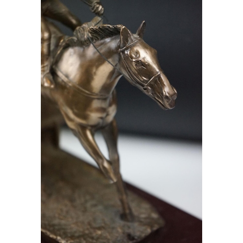 326 - Two horse racing trophies together with a brass door stop in the form of a horse and a pair of horse... 