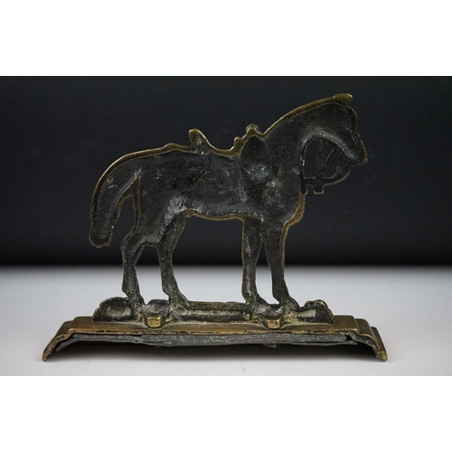 326 - Two horse racing trophies together with a brass door stop in the form of a horse and a pair of horse... 