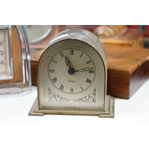 327 - A box of mixed collectables to include three desk clocks, barometer, gaming counters, letter racks, ... 