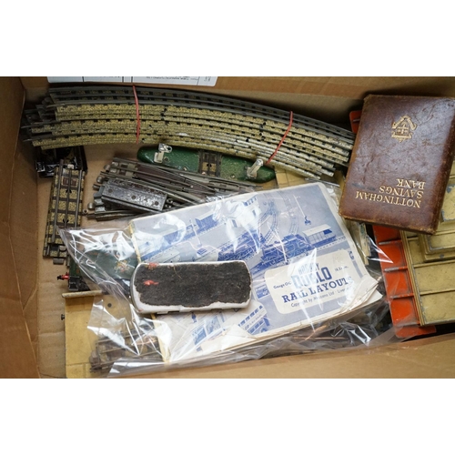 328 - A box of mixed collectables to include a mid 20th century first aid kit, vintage model rail, camera,... 