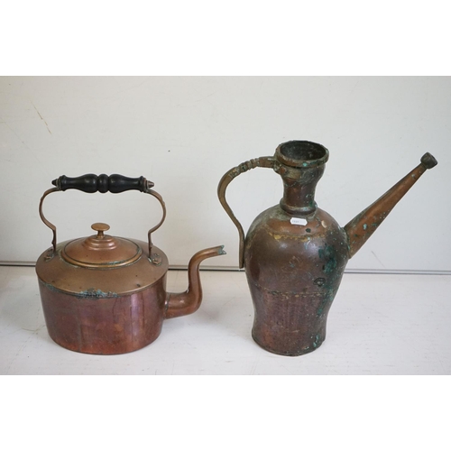 329 - A collection of mixed metalware to include a copper jug, copper kettle, brass trivet, kitchen scales... 