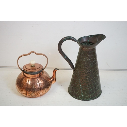 329 - A collection of mixed metalware to include a copper jug, copper kettle, brass trivet, kitchen scales... 