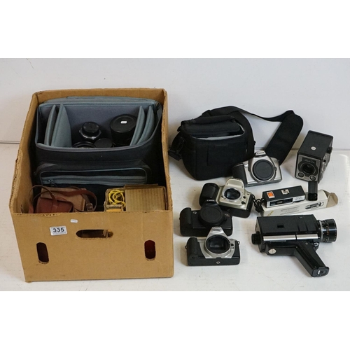 335 - Large quantity of photography items to include Canon cameras, Nikon, Kodak box cameras, lots of lens... 