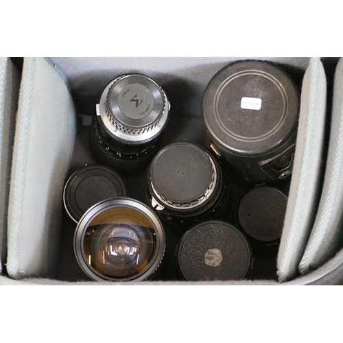 335 - Large quantity of photography items to include Canon cameras, Nikon, Kodak box cameras, lots of lens... 