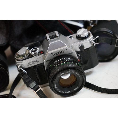 339 - A collection of vintage photographic equipment and cameras to include a Canon AE-1 35mm SLR camera w... 