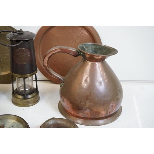 340 - A collection of mixed metalware to include a ship lamp, miners lamps, copper jug, barometer, bell, g... 