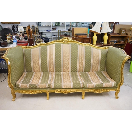 502 - Louis XV style Carved Gilt Wood Three Piece Suite comprising a three seater settee (230cm long x 113... 