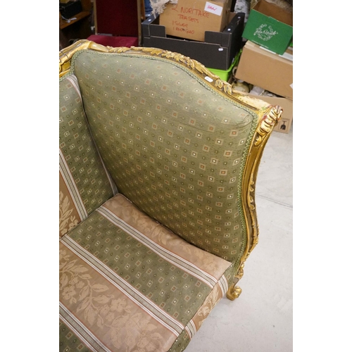 502 - Louis XV style Carved Gilt Wood Three Piece Suite comprising a three seater settee (230cm long x 113... 