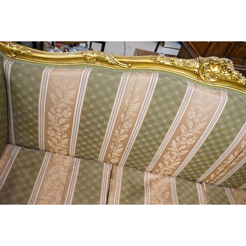 502 - Louis XV style Carved Gilt Wood Three Piece Suite comprising a three seater settee (230cm long x 113... 