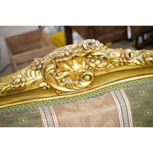 502 - Louis XV style Carved Gilt Wood Three Piece Suite comprising a three seater settee (230cm long x 113... 