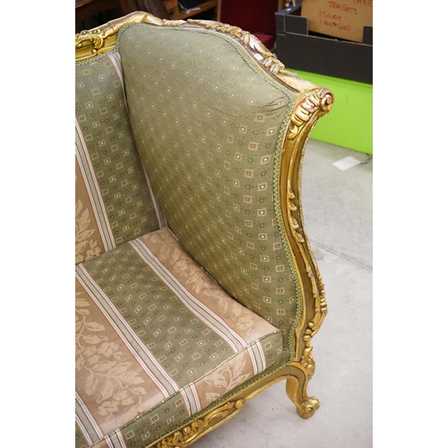 502 - Louis XV style Carved Gilt Wood Three Piece Suite comprising a three seater settee (230cm long x 113... 