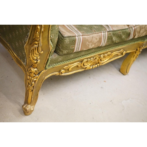 502 - Louis XV style Carved Gilt Wood Three Piece Suite comprising a three seater settee (230cm long x 113... 