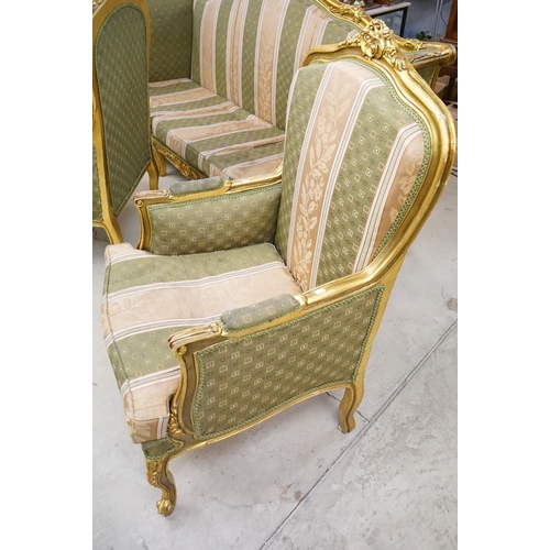 502 - Louis XV style Carved Gilt Wood Three Piece Suite comprising a three seater settee (230cm long x 113... 