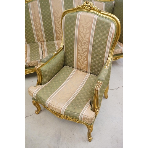 502 - Louis XV style Carved Gilt Wood Three Piece Suite comprising a three seater settee (230cm long x 113... 