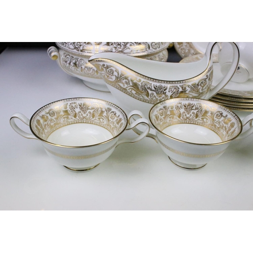 117 - Wedgwood 'Gold Florentine' part dinner service for 6 (pattern no. W4219), to include 2 tureens & cov... 