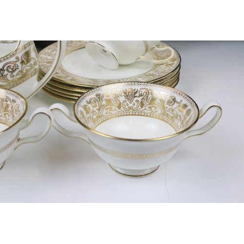 117 - Wedgwood 'Gold Florentine' part dinner service for 6 (pattern no. W4219), to include 2 tureens & cov... 